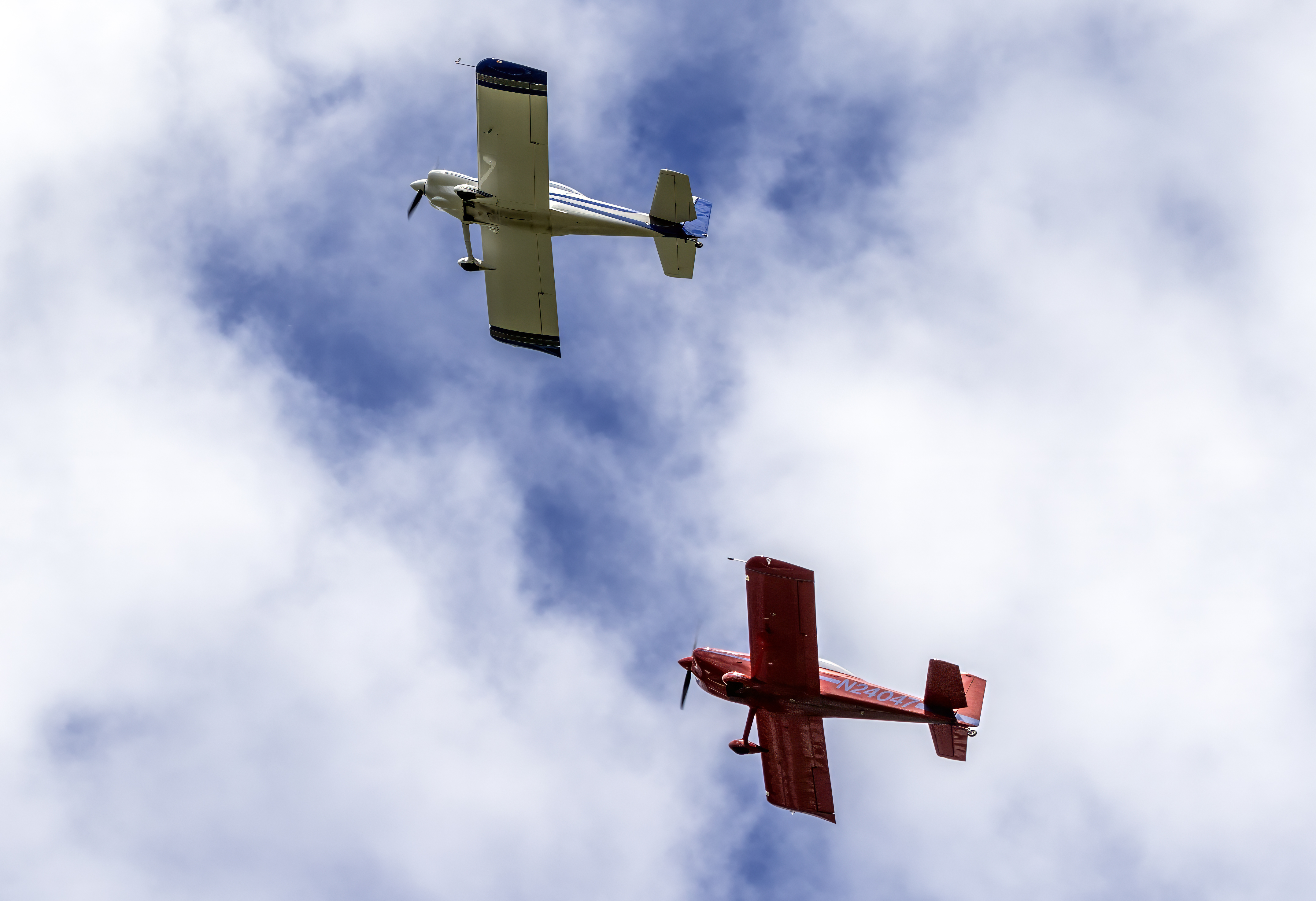A Van's RV-8 and a Van's RV-4, both tandem two-seat kit airplanes, flying over Frederick Municipal Airport, Maryland, in May 2024. Photo: Acroterion, CC BY-SA 4.0, via Wikimedia Commons.